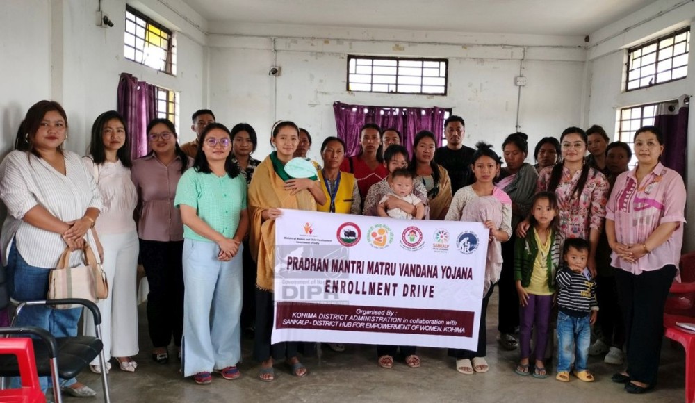 Officials and participants during the PMMVY enrolment drive and awareness program on Women-Centric schemes held at Kezoma Village, Kohima. (DIPR Photo)